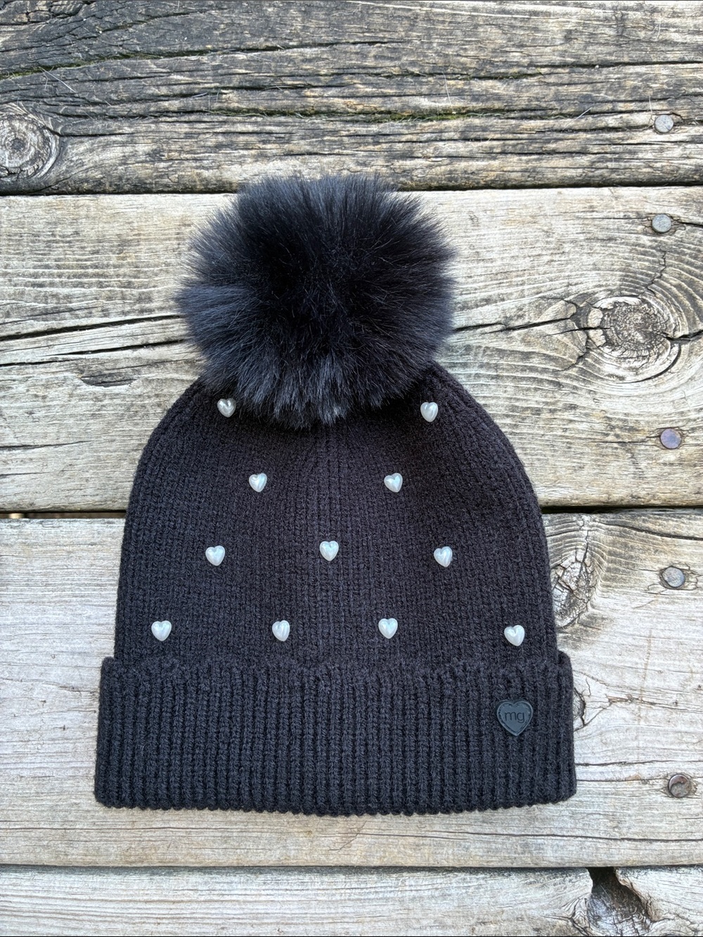 Madden Girl Black Pom-Pom Beanie with Heart Studs